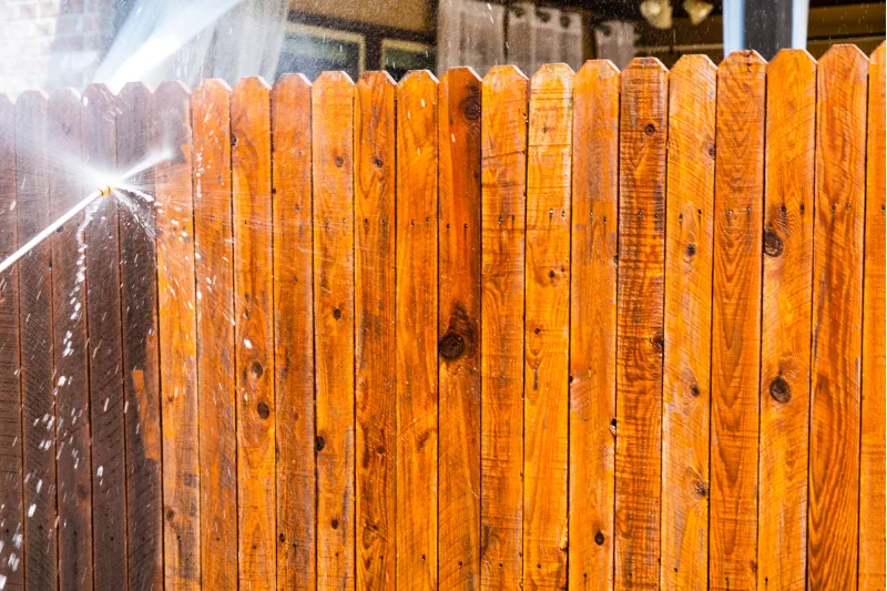 Fence Washing Timber fence restored with professional pressure cleaning